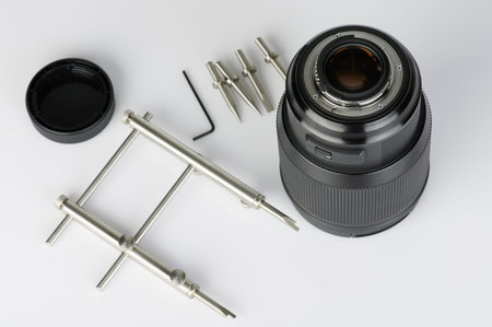 Metal wrench tool for cleaning lens isoalted on white background