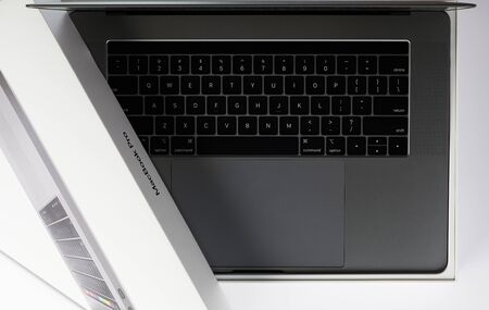 New york, USA - july 24, 2019: Open box of gray apple laptop with new keyboardのeditorial素材