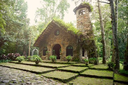 Stone church in forest with grass on roof in Nicaragua Matagalpaの写真素材