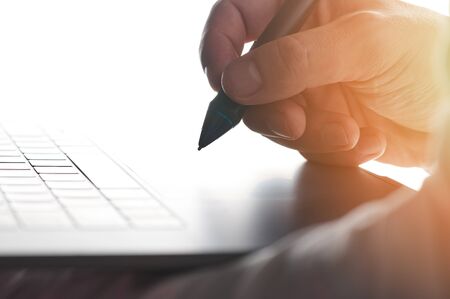 Electronic signature on laptop close up view. Signing digital documentの写真素材