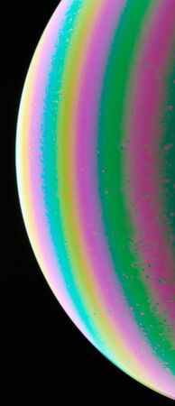 Rainbow color liquid sphere surface macro close up viewの写真素材