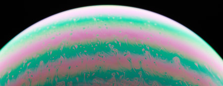 Green and pink liquid background macro close up view
