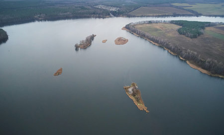 Small islands in river landscape above drone view