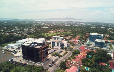 Modern business building in Managua aerial drone view on sunny dayの写真素材