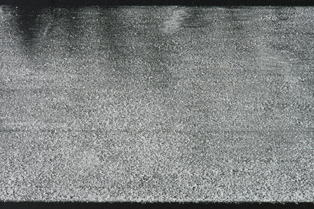 White chalk stroke on black board background