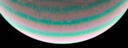 Green and pink abstract liquid bubble macro close up viewの写真素材