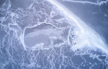 Frozen river winter background above drone top view