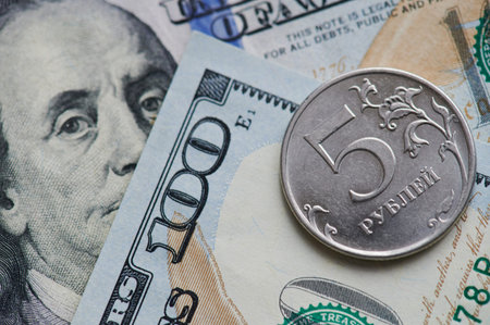Five russian ruble coin on dollar background close up view