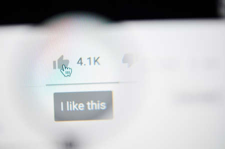 New-York , USA - March 13, 2020: I like this youtube video on laptop screen close up viewのeditorial素材
