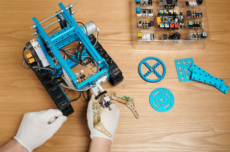 Learning robotics theme. Assembling robot kit educational program