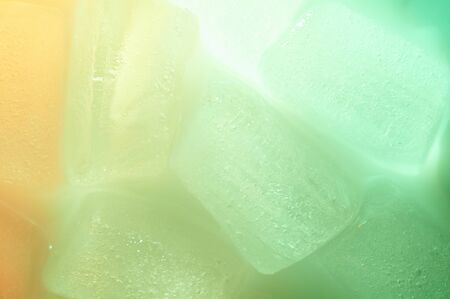 Green color ice cubes pattern close up backgroundの写真素材