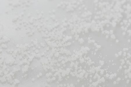 Small white wax balls granules macro close up viewの写真素材