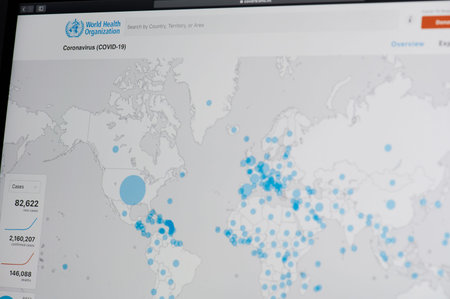 New-York , USA - April 18 , 2020: Checking map of coronovirus spread in WHO website close up view on...