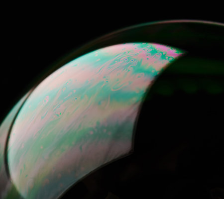 Abstract pink and green bubble surface background close up view