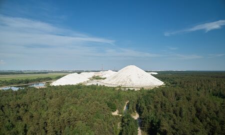 Hard emission waste from plant aerial drone view on blue sky backgroundの写真素材