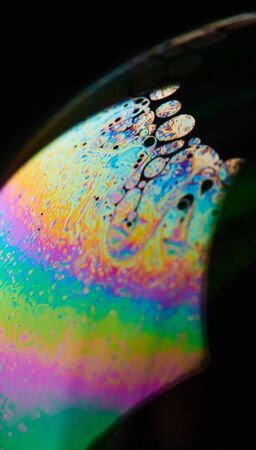 Rainbow color surface of soap ball macro close up viewの写真素材