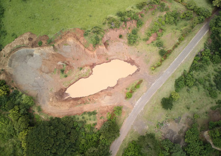 Big trench above top  drone view around green field