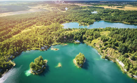 Clean green water in lake aerial drone view on sunny dayの写真素材