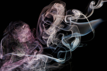 Abstract smoke transparent  brown color swirl on black background. Abstract wallpaper