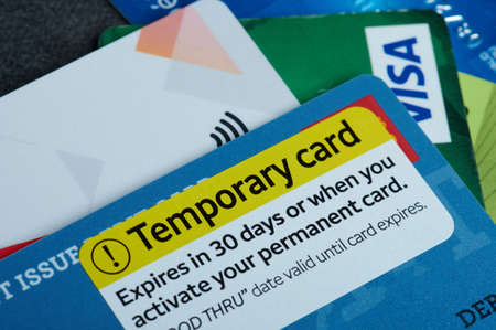 New york, USA - October 9, 2020: Temporary plastic debit card macro close up view on colorful backgroundのeditorial素材