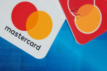 New york, USA - October 9, 2020: Mastercard debit card on colorful background close up viewのeditorial素材