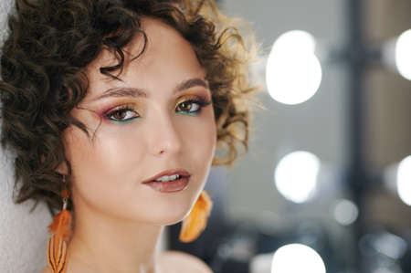 Headshot of pretty woman on blur background of studioの写真素材