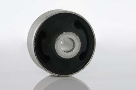 Metal cylinder with black rubber isolated on white backgroundの写真素材