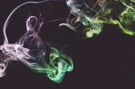 Smooth abstract smoke colorful curves line shape on grey  backdropの写真素材