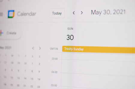 New york, USA - February 17, 2021: Trinity Sunday 30 of may  on google calendar on laptop screen...