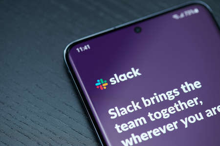 New york, USA - February 25, 2021: Slack app menu on smartphone screen close up viewのeditorial素材