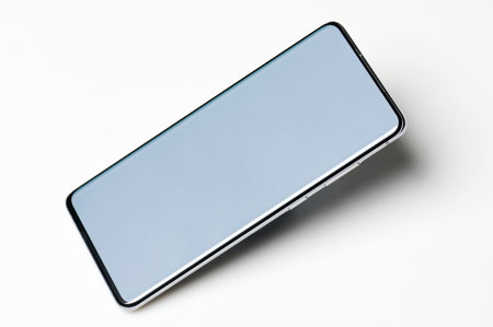 Smartphone screen side view with shade isolated on white studio backgroundの写真素材