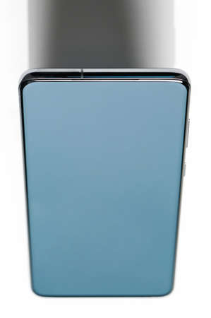 Smartphone on podium above top view with shade isolated on white studio backgroundの写真素材