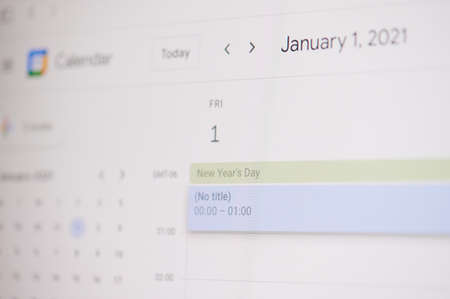 New york, USA - February 17, 2021: New year day 1 of january  on google calendar on laptop screen close up view.のeditorial素材