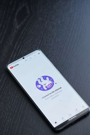 New york, USA - March 22, 2021:Limited youtube app app on smartphone screen laying on tableのeditorial素材