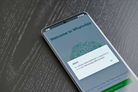 New york, USA - March 22, 2021: Blocked or lost connection Whatsapp app on smartphone screen laying on tableのeditorial素材