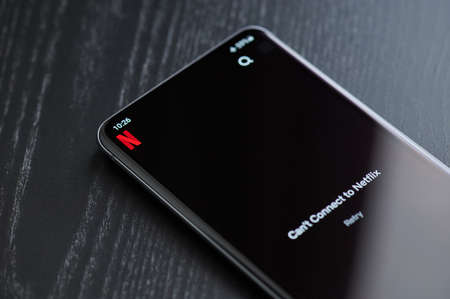 New york, USA - March 22, 2021: Blocked or lost connection netflix app on smartphone screen laying on tableのeditorial素材