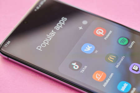 New york, USA - April 23, 2021: Popular apps on smartphone menu screen macro close up viewのeditorial素材