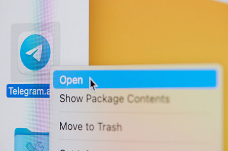 New york, USA - April 19, 2021: Click and open telegram app on laptop screen macro close up view