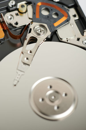 Shiny metal open hard drive macro close up view