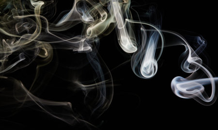 Yellow swirl smoke line flow on black isolated background