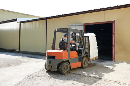 Forklift move cargo from warehouse to shipment base