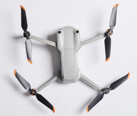 Modern foldable drone above top view isolated on studio backgroundの写真素材