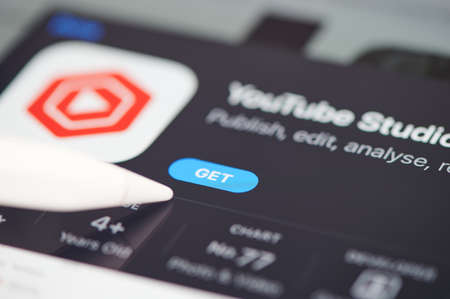 New york, USA - September 24 2021: Install youtube studio on ipad screen close up view using penのeditorial素材