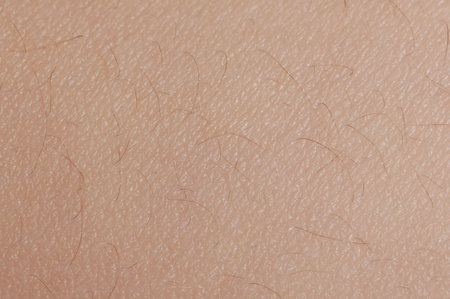 Small hair on human skin surface macro close up view