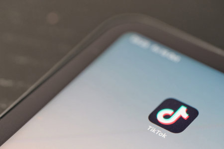 New york, USA - October 15 2021: Tik tok social app icon on smartphone screen close up view