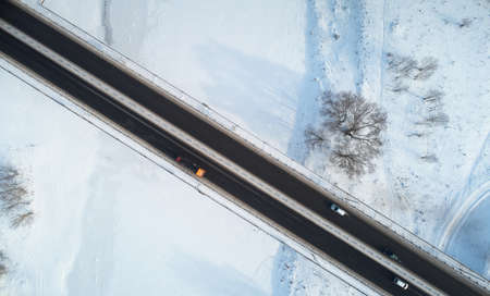 Travel on car in winter time theme. Bridge on winter covered snow backgroundのeditorial素材