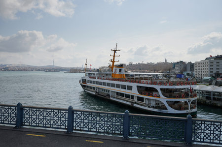 Istanbul, Turkey - March 24 2022: Ferry in port of Istanbul on cityscape of Bosphorus
