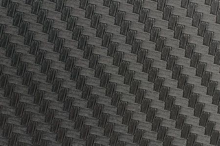 Texture of carbon fiber material flat view macro