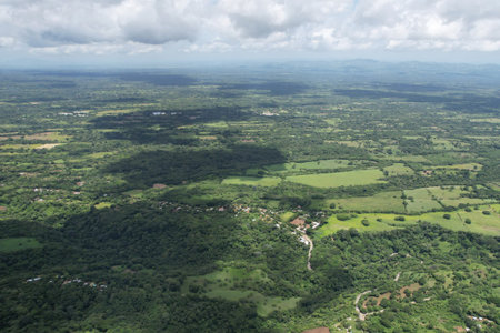 Big cloud shadow on green landscape background aerial drone viewの写真素材