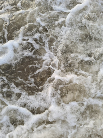 Surface of foamy sea water background close up viewの写真素材